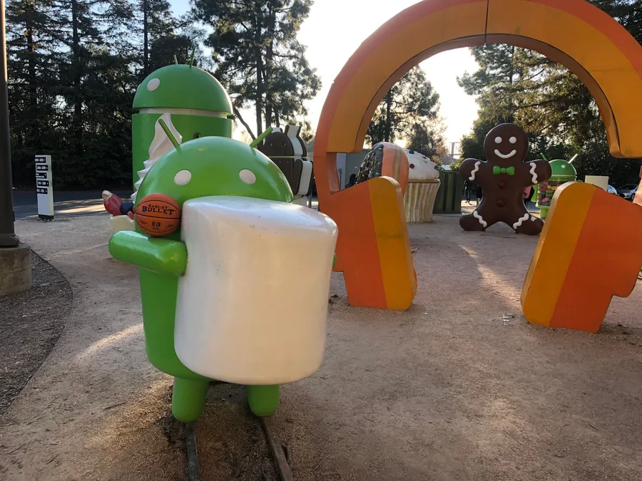 A Basket Bullet medicine ball beside an Android statue