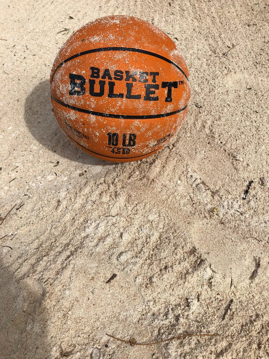 A Basket Bullet medicine ball on a beach