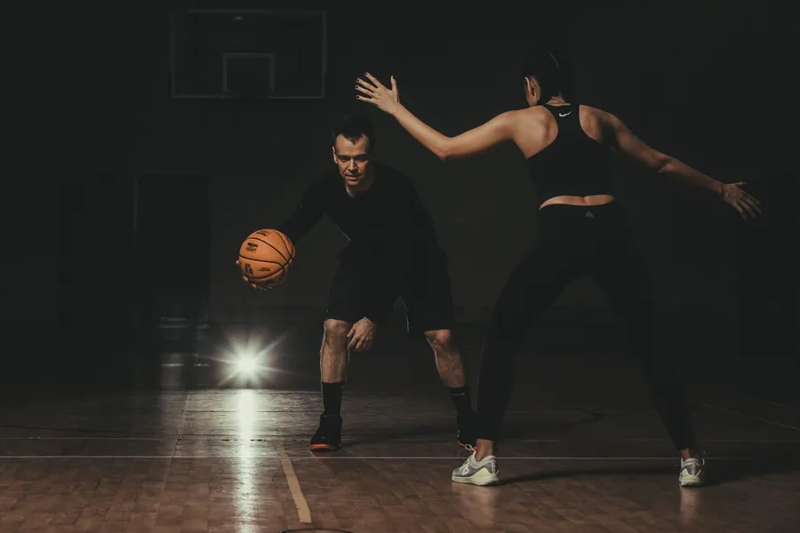Defensive stance with a Basket Bullet medicine ball